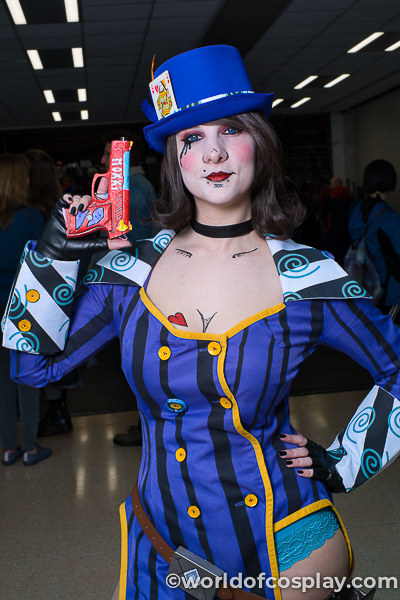 @kydraganne cosplaying as Mad Moxxi from Borderlands 3, with her personalised pistol.