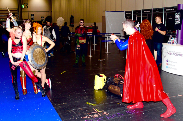 Superman photographs female cosplayers.