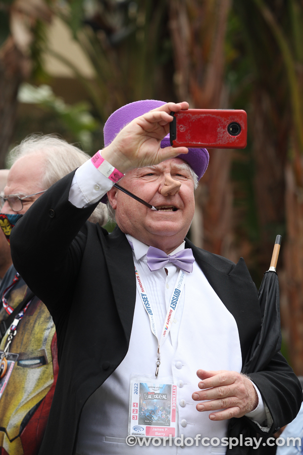 Penguin cosplayer taking photos.